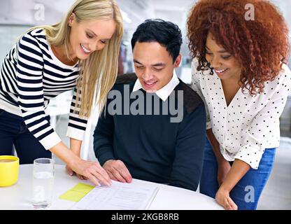 Lets move forward with this then. A group of colleagues discussing business matters. Stock Photo