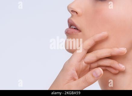 Caressing her soft skin. Closeup shot of a young woman with beautiful skin. Stock Photo