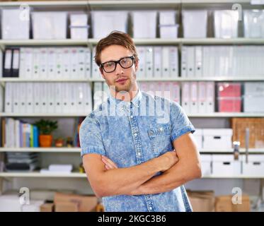 Styling in the office. a stylish young man in an office. Stock Photo