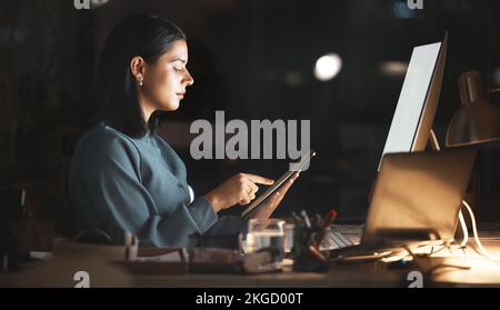 Laptop, computer or business woman on tablet at night in office for research, cloud computing or planning marketing schedule. IT, programmer or Stock Photo