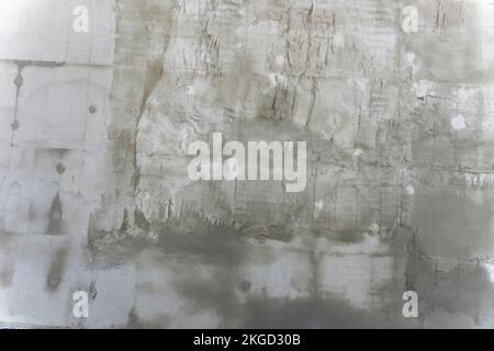 grey concrete textured background of the plastered wall of the building Stock Photo
