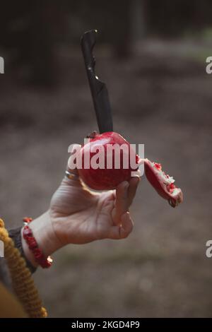 Close up knife in pomegranate concept photo Stock Photo