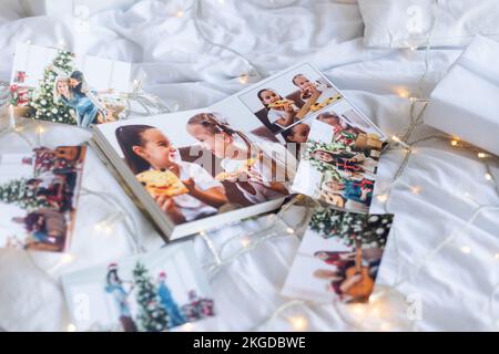 Photos of children against Christmas lights background Stock Photo