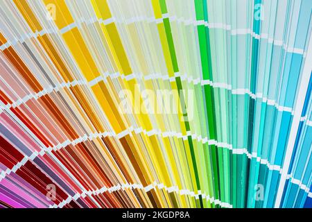 Color swatch fan on wooden board top view. Stock Photo