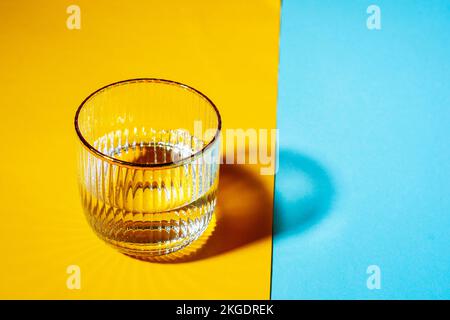 Glasses with water on two tone background with copy space Stock Photo