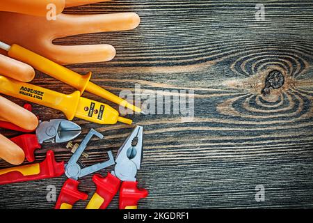 Composition of insulating electric tools on wooden board. Stock Photo