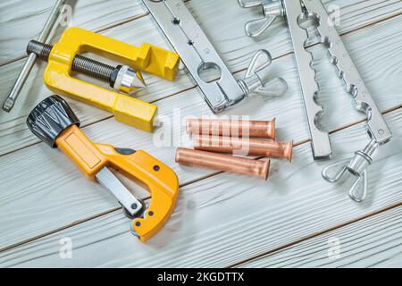construction tools set for flaring pipe brake plumper clamp cutter on wooden background Stock Photo
