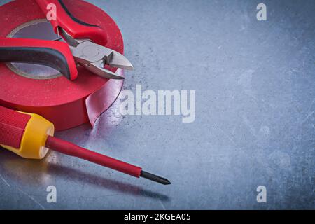 Insulation tape nippers insulated screwdriver construction concept. Stock Photo