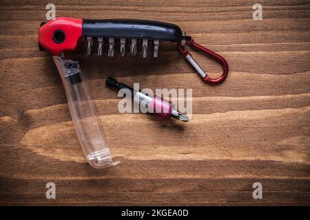 Interchangeable turnscrew bits in toolbox on wood board construction concept. Stock Photo