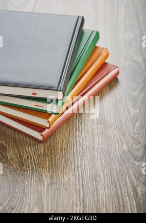 notebooks on wooden board Stock Photo