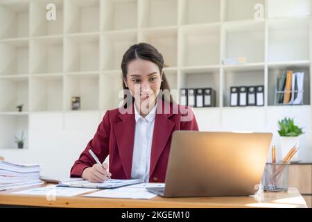 Business Financing Accounting Banking Concept, businesswoman doing finances and calculate about cost in other, tax system. Stock Photo