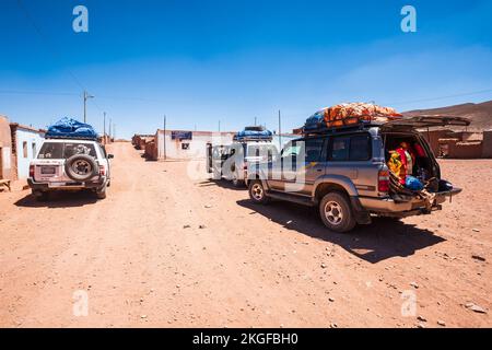 Four-wheels vehicles stopped on Cerrillos community in the Bolivian High Plains during a guided tour to Uyuni, Bolivia Stock Photo