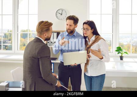 Inspired successful business team working together on new startup project in modern office. Stock Photo