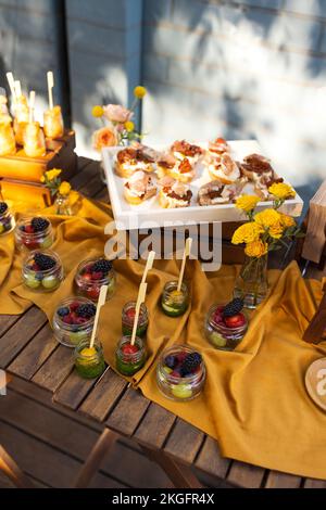 Backyard barbeque party at summer, elegant decoration, luxury catering, tasty and beautiful food on open air, drink and buffet standing reception, wed Stock Photo