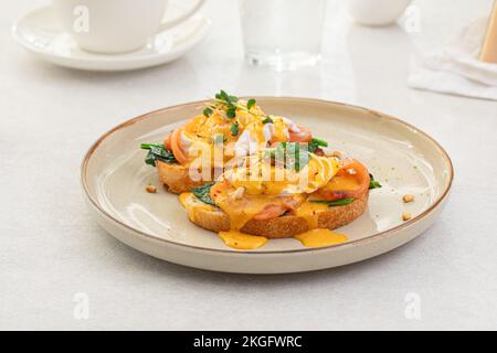 Portion of eggs benedict toast with salmon Stock Photo