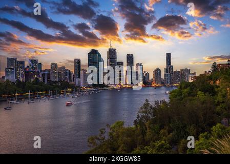 Dramatic sunset over Brisbane skyline and Brisbane river Stock Photo