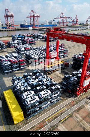 SUQIAN, CHINA - NOVEMBER 23, 2022 - A batch of vehicles are about to be exported to the European market at the Taicang Port terminal in Suzhou, Jiangs Stock Photo