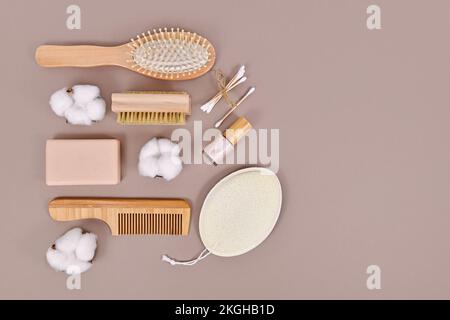 Eco friendly wooden beauty and hygiene products like comb and soap on gray background with copy space Stock Photo