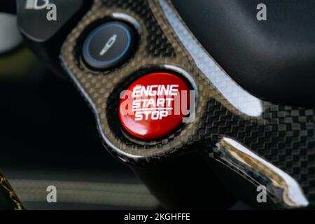 A closeup shot of details on an engine start and stop button in a Ferrari 488 GTB car Stock Photo