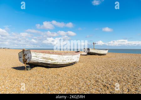 Two old clinker built fishing boats rotting on Aldeburgh beach, suffolk 2022 Stock Photo