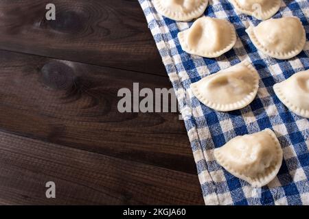 raw polish dumplings on the table Stock Photo