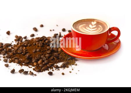 Cup of coffee on a heap of roasted coffee beans. beautiful coffee background. Stock Photo