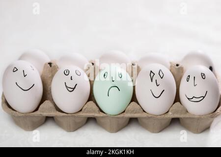Funny faces and emotions drawn on white eggs with marker Stock Photo