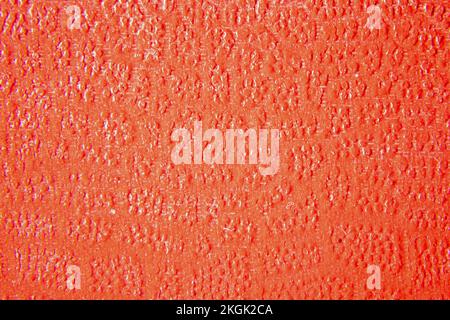 Close up of orange leather texture. Grunge skin fabric background. Stock Photo