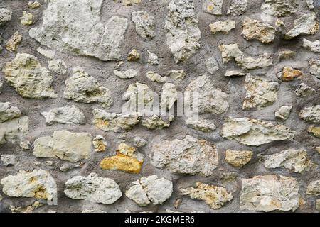 Brown rustic stone wall of an old castle. Stone background. Stock Photo