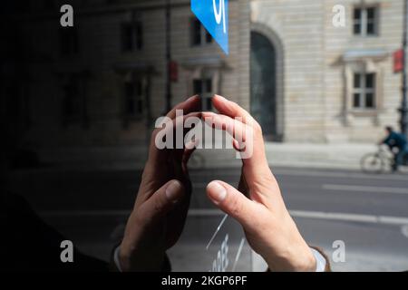Hand of woman using touch screen kiosk Stock Photo