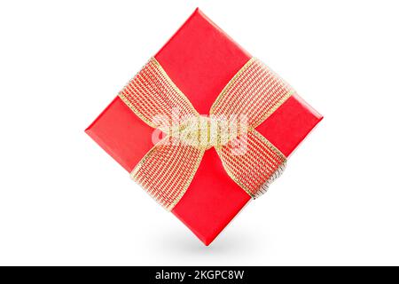Red gift box with golden ribbon isolated on white background. Stock Photo