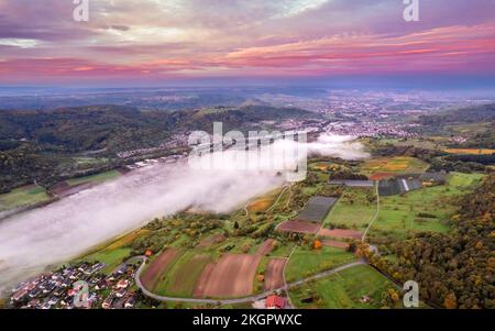 Germany, Baden-Wurttemberg, Drone view of Remstal valley at foggy dawn Stock Photo
