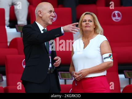 23 November 2022, Qatar, Al Rayyan;: German Football Association (DFB) president Bernd Neuendorf with German Minister of the Interior and Sports Nancy Faeser moments before the start of Germany's opening match against Japan at the 2022 World Cup in Qatar. Faeser wore the controversial 'One Love' armband, banned by FIFA for the captains of seven European teams. Photo: Federico Gambarini/dpa Stock Photo