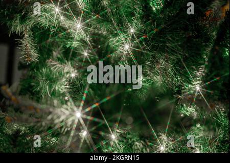 Christmas lights glowing on Christmas tree Stock Photo