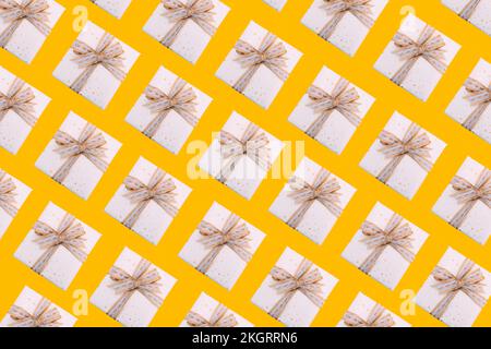 Multiple image of gift boxes on yellow background Stock Photo