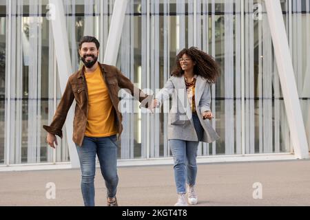 Happy young couple walking and enjoying at footpath Stock Photo