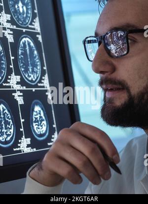 Doctor examining medical brain scan Stock Photo