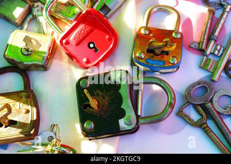 Ancient padlocks and keys and sunbeam on locks with white background Stock Photo