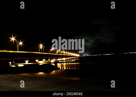 A beautiful view of illuminated Hornibrook Bridge in Brisbane Australia under black sky Stock Photo