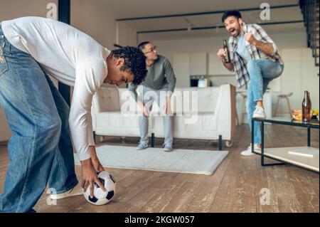 Young man preparing to play football with friends Stock Photo
