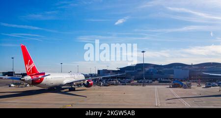 Virgin Atlantic Boeing 787-9 Dreamliner jet aircraft with red tail fin and logo on the tarmac at London Heathrow Airport Stock Photo