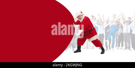 Santa Claus pushing huge bag of gifts isolated on white with copy space ...