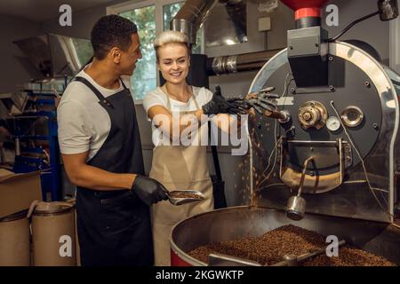 Roast masters working in a coffee company Stock Photo