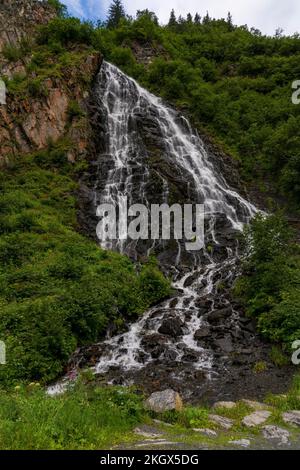 A vertical shot of the Horsetail Falls at Keystone Canyon in Valdez, Alaska Stock Photo