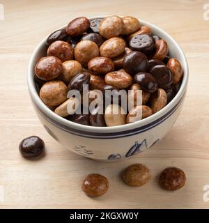 Chocolate and coffee tasting sugar covered on traditional Dutch kruidnoten, cookies,  in a bowl close up Stock Photo