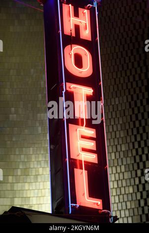 Outdoor neon sign on a vintage hotel Stock Photo