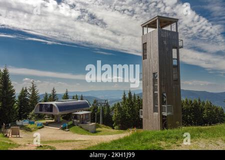 Wooden lookout tower at bear mountain in jeseniky mountains, upper station of chairlift. Stock Photo