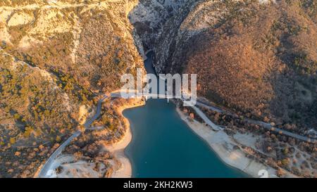 Aerial view of the Pont du Galetas at the limit of the Gorges du Verdon and Lac de Sainte-Croix in Aiguines. Stock Photo