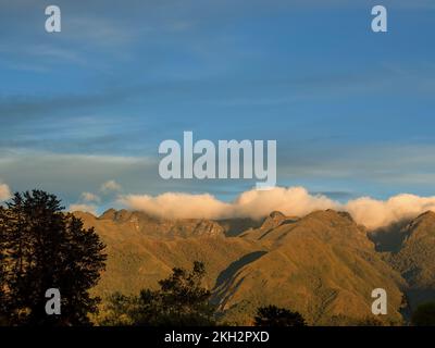 The Iguaque mountain illuminated by the light of the sunset, near the town of Arcabuco in central Andean mountains of Colombia. Stock Photo
