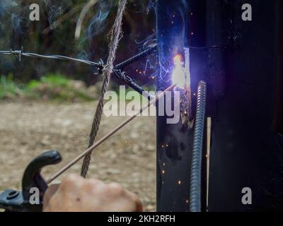 Close-up photography of the poor action of a welding electrode due to low energy, captured in the rural area near the town of Arcabuco in central Colo Stock Photo